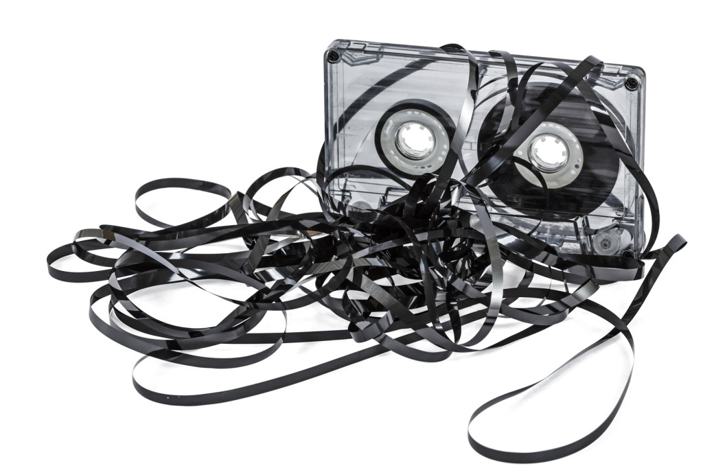 Close up of vintage audio tape cassette, isolated on white